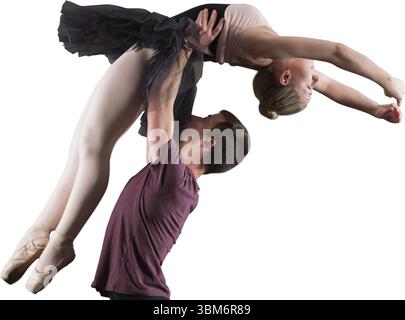 Male dancer lifting female ballet dancer overhead in flat design with black tutu and white backdrop Stock Photo