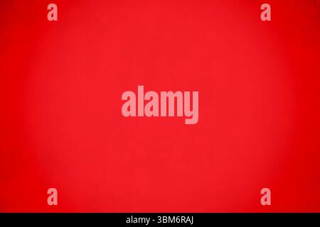 Abstract flat design is showing bright red background with subtle vignette texture, copy space Stock Photo