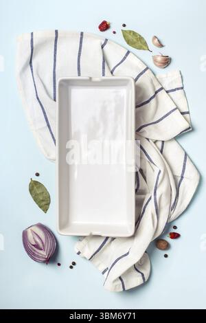 Empty ceramic baking tray and spice set. Cooking concept Stock Photo