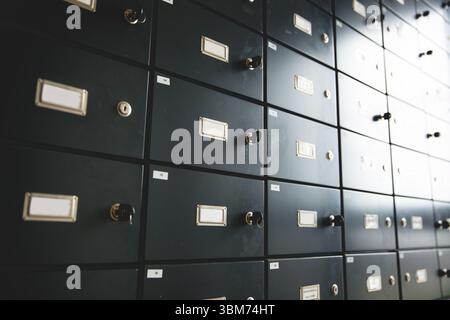 Safety deposit boxes are filling vault in 3D render, showing label holders, keyed knobs Stock Photo