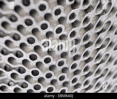 3D-printed metal grid,  three-dimensional openwork lattice close up shot. Abstract modern technology background. Stock Photo