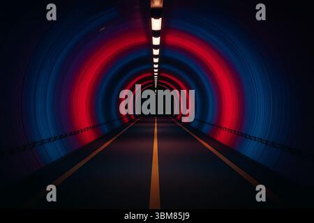 Underground tunnel with red and blue lights. Stock Photo