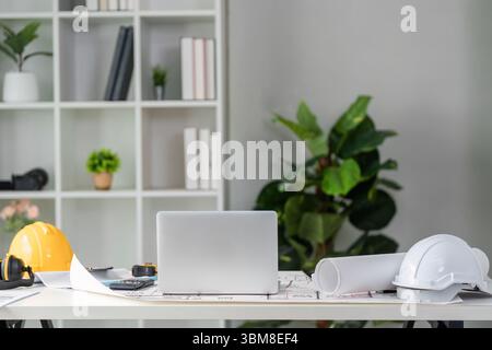 Workspace and Project Organization. An organized architectural workspace featuring tools and equipment for construction projects. Stock Photo