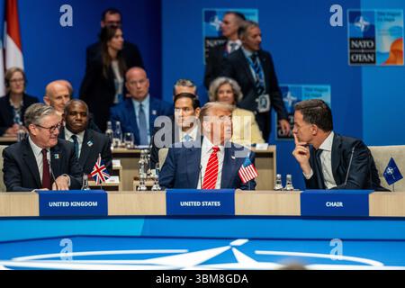 June 25, 2025, The Hague, South Holland, Netherlands: US President DONALD TRUMP speaks with NATO Secretary General MARK RUTTE while Prime Minister of the United Kingdom KEIR STARMER listens on. On June 25, 2025, leaders and representatives from all 32 NATO countries gathered at the World Forum in The Hague, the Netherlands to participate in the NATO Summit. Topics of concern this year were the conflicts in the Middle East, Ukraine, yearly member-state contributions, and broader topics of deterrence and defense, cyber security, and collective defense under Article 5 of the North Atlantic Treaty Stock Photo