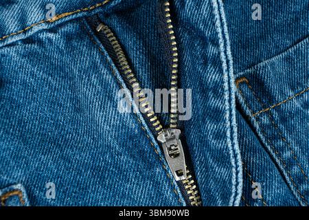 Macro Close-Up of Denim Zipper on Blue Jeans. Stock Photo