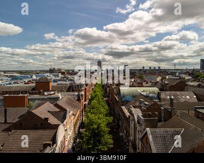 Liverpool cityscape with Bold Street dividing buildings and rooftops under a cloudy sky, aerial perspective Stock Photo