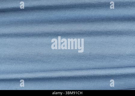 Smooth Blue Fabric Background with Artistic Abstract Design and Text Space. Stock Photo