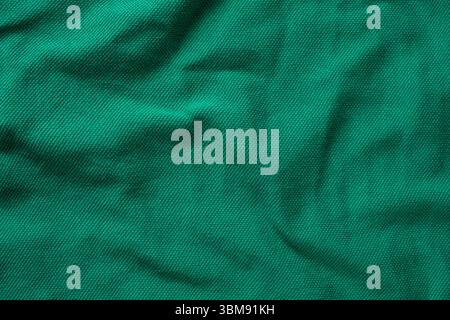 Close-Up of Abstract Green Emerald Cotton Textile Surface Top View. Stock Photo