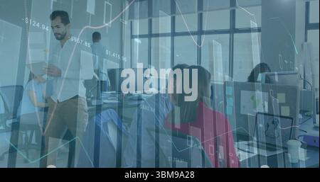 Reviewing data overlay, financial analyst in business casual holding tablet at office with monitors. Corporate, teamwork, analytics, modern, professio Stock Photo