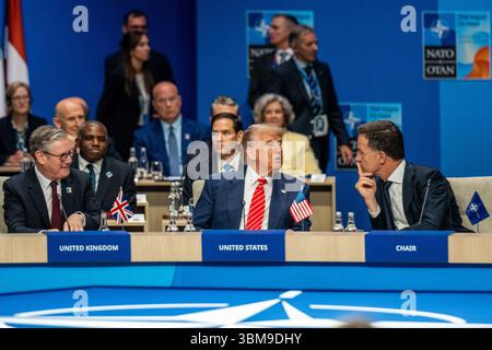 June 25, 2025, The Hague, South Holland, Netherlands: US President DONALD TRUMP speaks with NATO Secretary General MARK RUTTE while Prime Minister of the United Kingdom KEIR STARMER listens on. On June 25, 2025, leaders and representatives from all 32 NATO countries gathered at the World Forum in The Hague, the Netherlands to participate in the NATO Summit. Topics of concern this year were the conflicts in the Middle East, Ukraine, yearly member-state contributions, and broader topics of deterrence and defense, cyber security, and collective defense under Article 5 of the North Atlantic Treaty Stock Photo