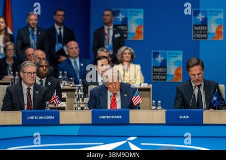 June 25, 2025, The Hague, South Holland, Netherlands: Prime Minister of the United Kingdom KEIR STARMER, US President DONALD TRUMP, and Secretary General of NATO MARK RUTTE wait for the start of the Heads of State gathering of the North Atlantic Council meeting. On June 25, 2025, leaders and representatives from all 32 NATO countries gathered at the World Forum in The Hague, the Netherlands to participate in the NATO Summit. Topics of concern this year were the conflicts in the Middle East, Ukraine, yearly member-state contributions, and broader topics of deterrence and defense, cyber security Stock Photo