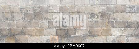 Seamless texture of an old stone brick wall creating a beautiful background Stock Photo