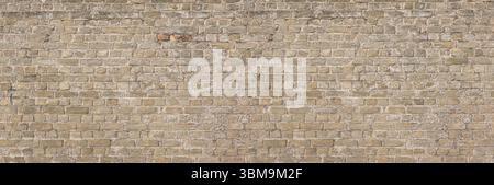 Seamless texture of an old beige brick wall, perfect for backgrounds and architectural visualization Stock Photo