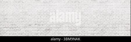 Wide panoramic background of an old whitewashed brick wall with copy space Stock Photo