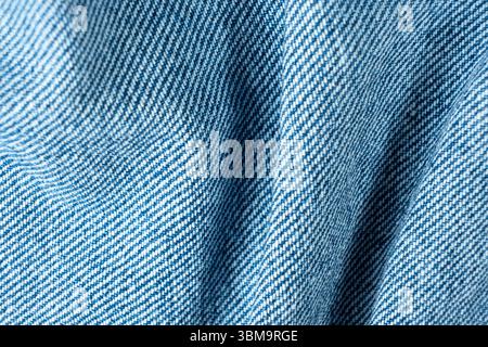 Denim Fabric with Organic Folds and Soft Shadows Macro. Pure Cotton Fabric Stock Photo
