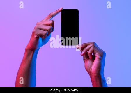 Two African American Male Hands Holding Smartphone With Black Screen, Mockup Image Stock Photo