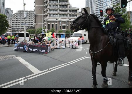 Environmental activists from Extinction Rebellion block the road during protest against NATO summit on June 25, 2025 in The Hague,Netherlands. Stock Photo