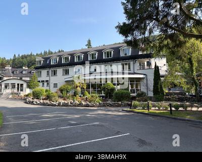 The Glendalough Hotel. Exterior view of the hotel building with gardens ...