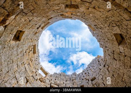 Drakano tower looking up inside military watchtower archeological site wall on Ikarian Sea, Greek Aegean islands region of Ikaria island, Greece Stock Photo