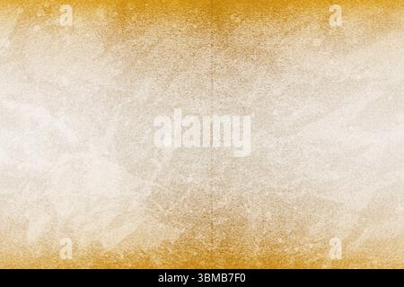 Grunge paper texture is filling entire frame, showing pale beige center with muted orange borders Stock Photo
