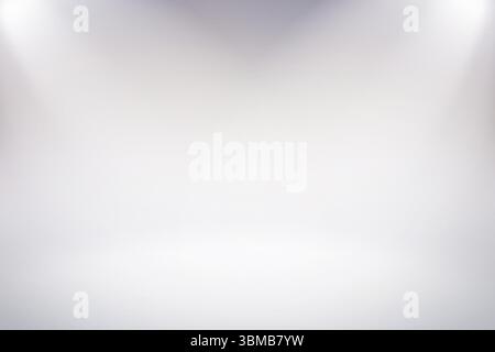 Flat design white backdrop is showing subtle gray gradient with soft corner spotlights in studio Stock Photo