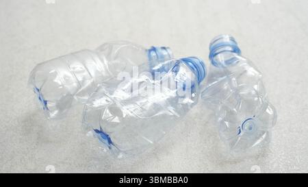 Empty rumpled used or crushed used plastic bottles isolated on white background Stock Photo