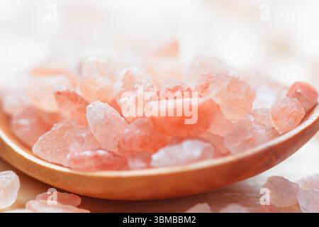 Closeup view of wooden spoon with Himalayan salt crystals Stock Photo