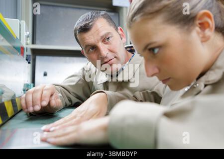 supplier with engineer checking on production in factory Stock Photo