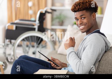 dsabled man using digital tablet Stock Photo