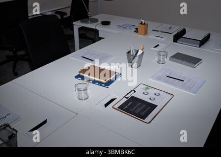 Empty Modern Office Workspace Featuring Documents and Stationery on Desk Stock Photo