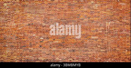 loft brick wall made of crumbling cobblestones, brickwork as background Stock Photo