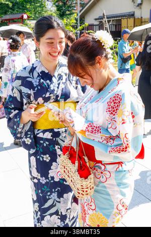 PEOPLE AT THE  TEMPLE SENSO-JI TOKYO Stock Photo