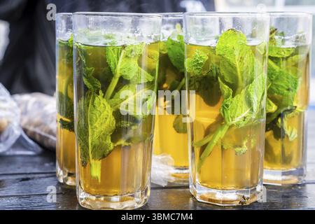 Glasses of mint tea with fresh leaves, Ibn Khaldoun Square, Asilah, Morocco, North Africa, Africa Stock Photo