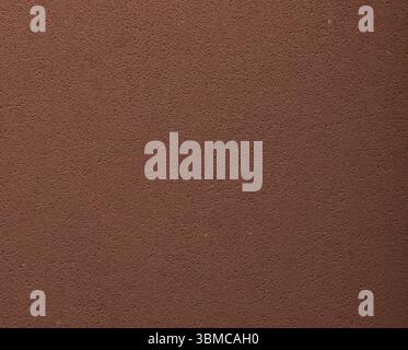 Flat designer paper in chocolate brown tones with smooth surface and pitted porous texture. Elegant spongy material in minimalistic chic style and pre Stock Photo