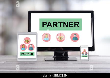 Partner concept shown on different information technology devices Stock Photo