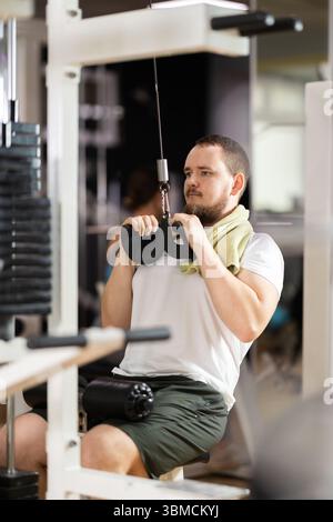 Athlete pulls the arm muscles Stock Photo - Alamy