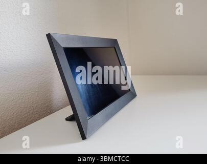Black picture frame mockup with a copy space on white countertop Stock Photo