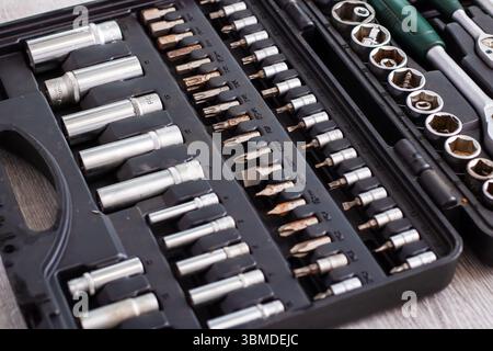A wellequipped toolbox that contains a diverse assortment of bits and sockets designed for various tasks and projects around the house Stock Photo
