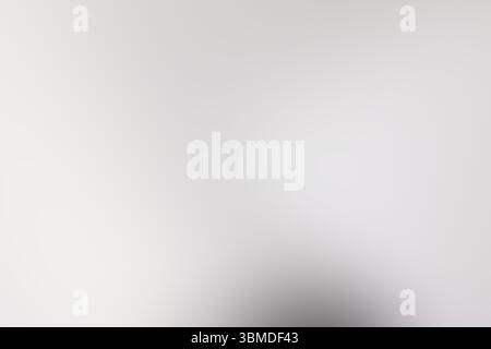 The image features a white background that smoothly transitions into a gray gradient located right in the center of the composition Stock Photo