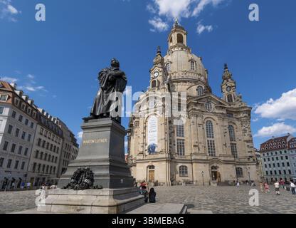 Monument to the reformer Martin Luther (1483-1546) with a Bible in his hand in front of the Church of Our Lady at Neumarkt in Dresden. Protestant Chri Stock Photo