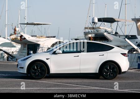 Benalmádena Costa, Málaga, Spain - June 22, 2025: Tesla model y parked at the port. Stock Photo