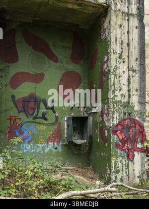 Detail of a closed entrance painted with graffiti to a former missile bunker on the Grosser Seeberg in Seebergen near Gotha, where a missile base of t Stock Photo