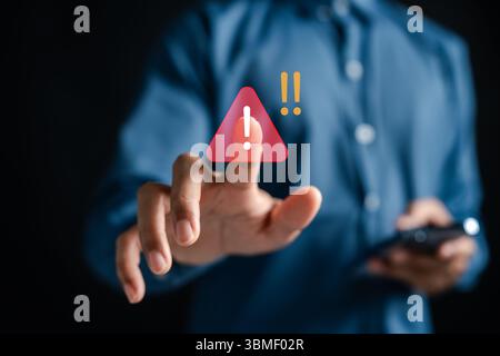 Digital danger alert icon with warning popup on smartphone screen. Stock Photo