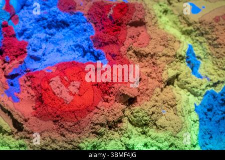 The abstract, random colours and textures from an augmented reality sandbox. Stock Photo