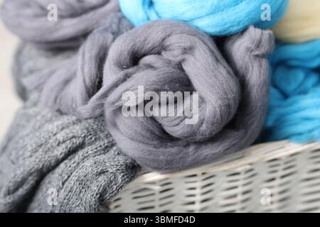 Soft felting wool in wicker basket, closeup Stock Photo