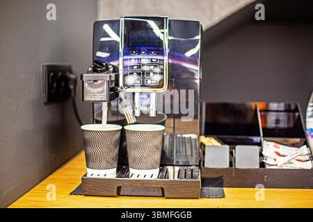 smart coffee machine in the office with stylish disposable cups made from recycled materials Stock Photo