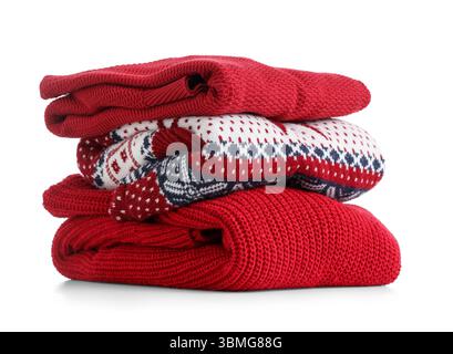 Stack of clean sweaters isolated on white background Stock Photo