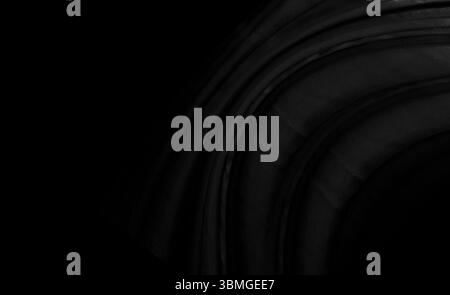 Curtain or fabric black wave. Luxury abstract background in isolated and copy space. Stock Photo