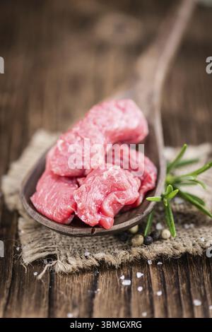 Chopped Beef Steak on wooden background (selective focus, close-up shot) Stock Photo
