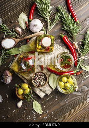 Flat lay food background made of oils condiments and spices on kitchen table. Cooking concept Stock Photo